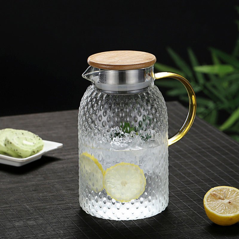 Glass water jug with lemon slices