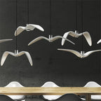 Hanglamp van hars met vogelsilhouet en warm of wit licht