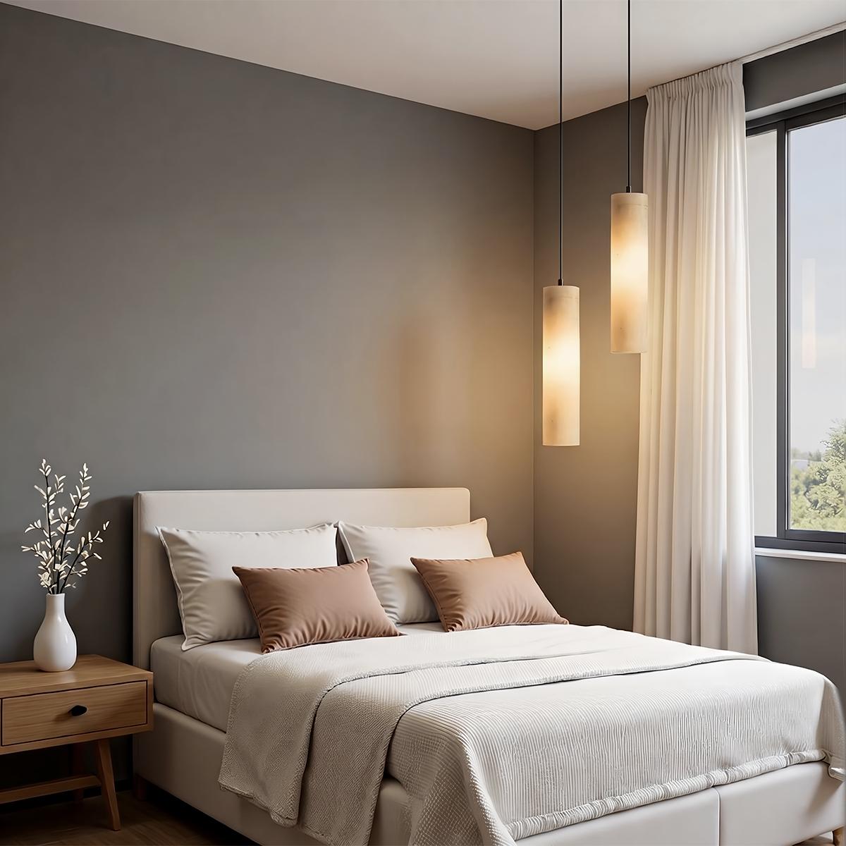 Lampadario a sospensione moderno con cilindri in alabastro e luce soffusa