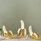 Finurlig bananbordlampe i varmtonet resin, BananaShine