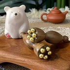 Seedpod Gua Sha-massager i mässing och rosenträ för ansiktslyftning - Fioriscas