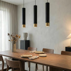 Minimalistyczna lampa wisząca Cylinder ze złotym akcentem do wysp kuchennych