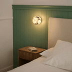 Lámpara de pared Stone Sphere Glow con luz interior cálida de mármol