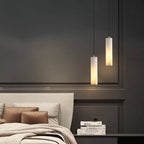 Lampadario a sospensione moderno con cilindri in alabastro e luce soffusa