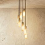 Lampadario a sospensione moderno con cilindri in alabastro e luce soffusa