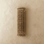 Copper Cascade Wall Sconce With Glass Cylinder Shade And Ambient Glow