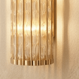 Copper Cascade Wall Sconce With Glass Cylinder Shade And Ambient Glow