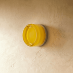 Lámpara de pared redonda de aluminio CircaGlow para un brillo ambiental cálido en espacios modernos