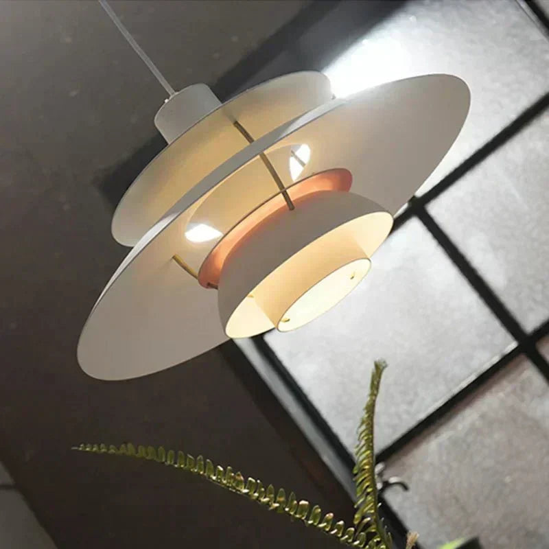 Lampada a sospensione Nexio, profilo cilindrico in metallo spazzolato