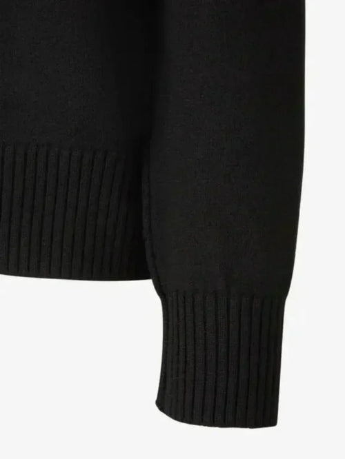 Maglione unisex in lana 100%, con dettaglio dell'emblema a cuore cucito
