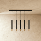Minimalistyczna lampa wisząca Cylinder ze złotym akcentem do wysp kuchennych