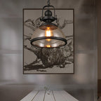Lámpara colgante industrial vintage de metal negro con cúpula de vidrio y bombilla expuesta  